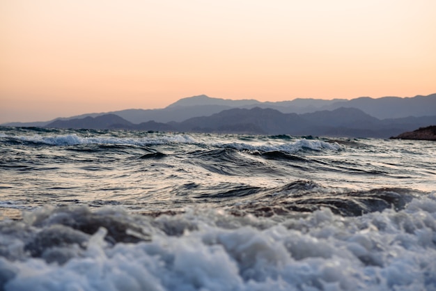 sunset over the sea the turbulent sea