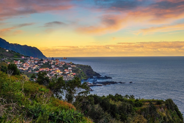 Sunset over seixal beach village on madeira portugal