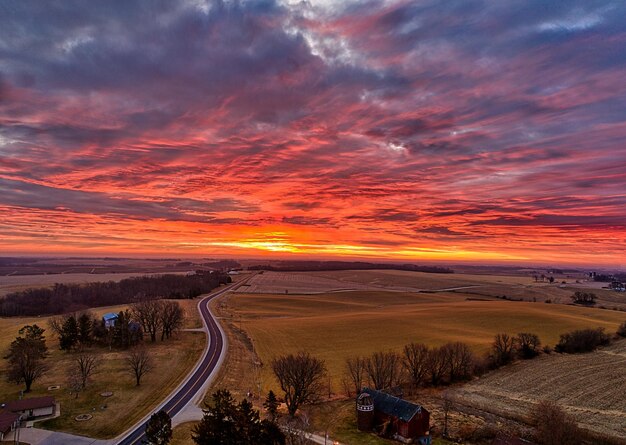 Photo sunset sky over countryside with meadow photo