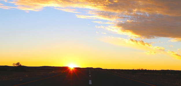 Sunset sky and road in the desert