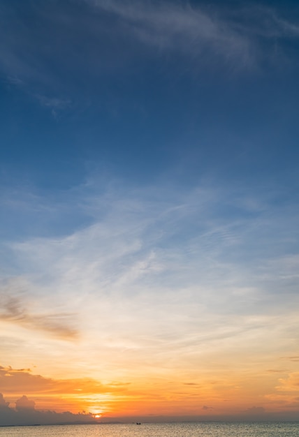 Sunset sky vertical over sea in the evening with colorful sunlight