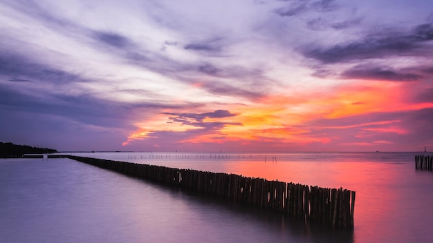 Sunset sky with dramatic sunset clouds over the sea Beautiful sunrise over Ocean