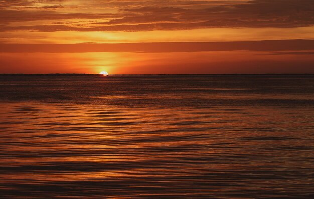 Sunset sun over ocean water natural sky colors sunrise seascape