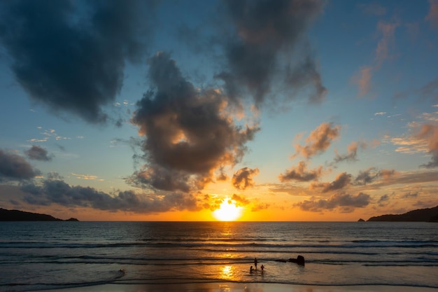 Sunset or sunrise sky clouds over seaBeautiful sunlight in the oceanAmazing nature landscape seascape Colorful sky clouds background