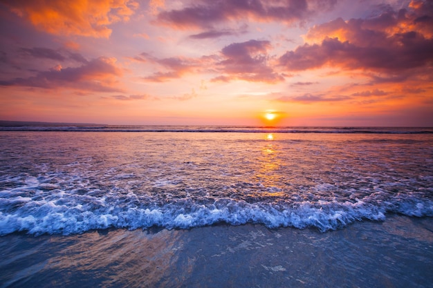 sunset view on sea with coming surf waves