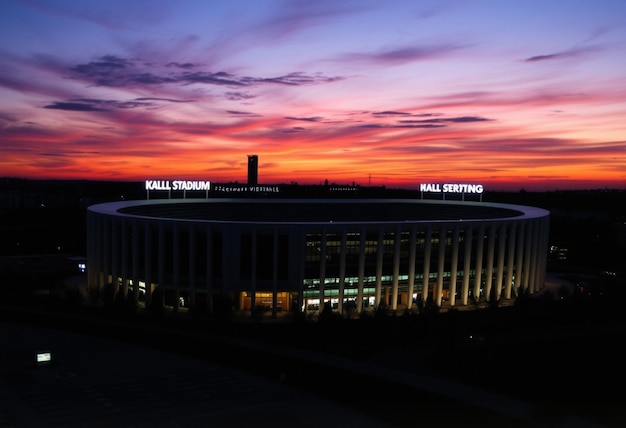 a sunset view of the stadium from the outside