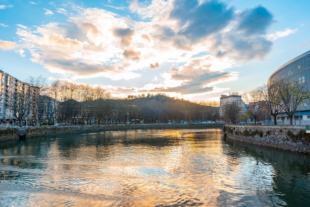 Sunset with clouds in the Uremea River of San Sebastian tourist city a spring morning Gipuzkoa Basque Country