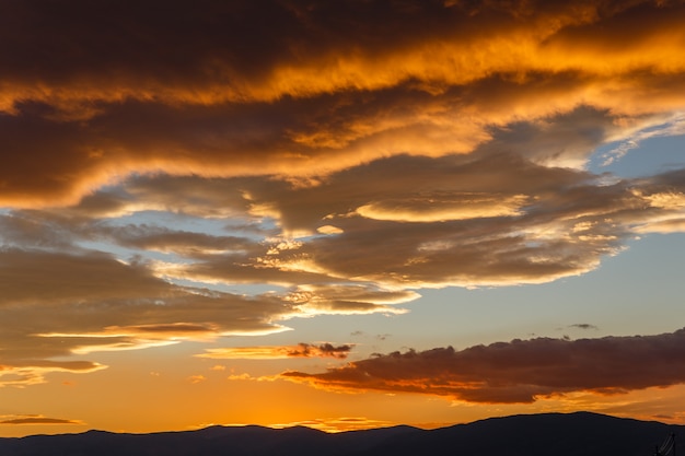 Sunset with dark heavy clouds, beautiful landscape