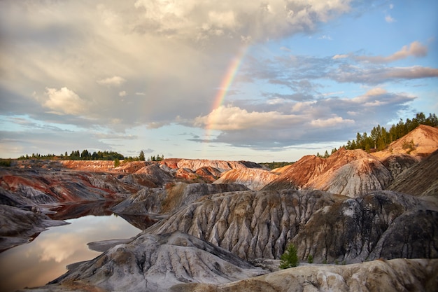 Sunset with a rainbow in the sand hills