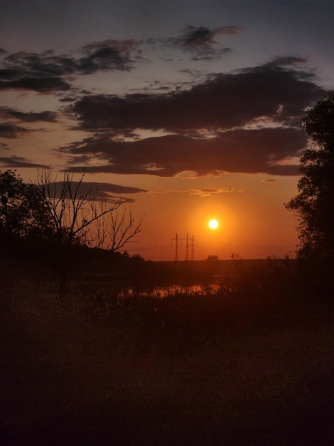 A sunset with the sun setting behind it