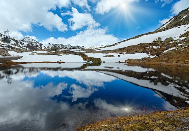 Sunshiny spring alps mountain lake Lago della Piazza (Switzerland, Passo del San Gottardo)