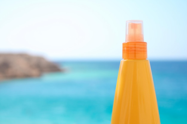 Suntan lotion on the beach summertime skincare and beauty styled concept