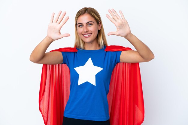 Super Hero caucasian woman isolated background counting ten with fingers