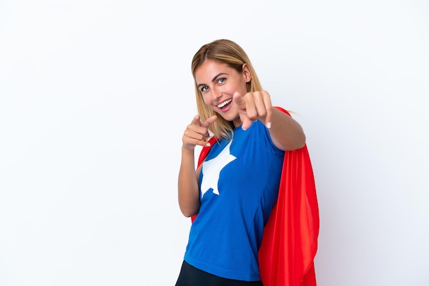 Super Hero caucasian woman isolated background pointing to the front and smiling