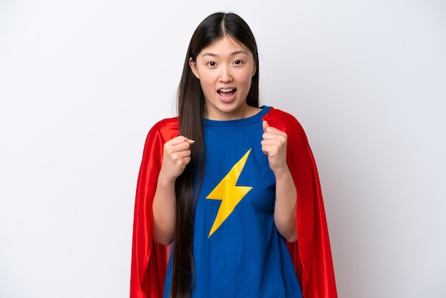 Super Hero Chinese woman isolated on white background celebrating a victory in winner position