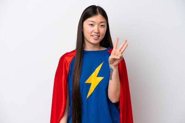 Super Hero Chinese woman isolated on white background happy and counting three with fingers