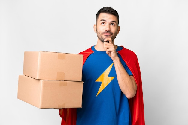 Super Hero delivery caucasian man over isolated white background having doubts and thinking