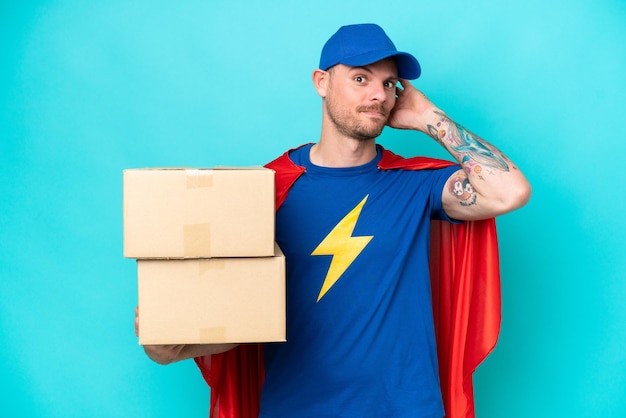 Photo super hero delivery man over isolated background having doubts