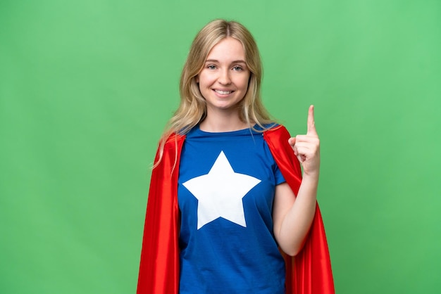 Super Hero English woman over isolated background showing and lifting a finger in sign of the best