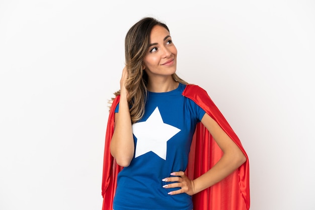 Super Hero woman over isolated white background thinking an idea