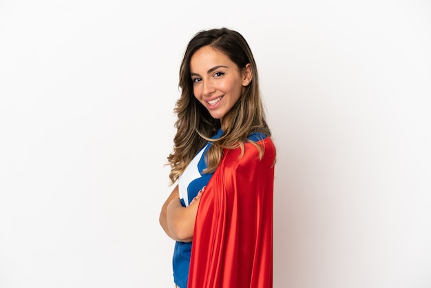 Super Hero woman over isolated white background with arms crossed and looking forward