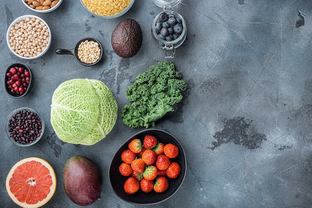 Superfoods dieting clean concept, top view, on grey table.