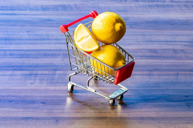 supermarket cart carrying  lemon