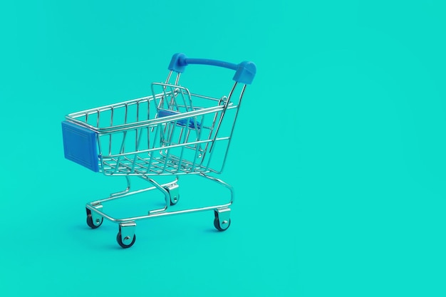 Supermarket trolley on blue background