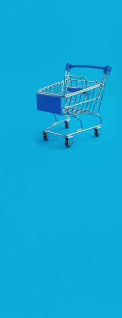 Supermarket trolley on blue panorama background