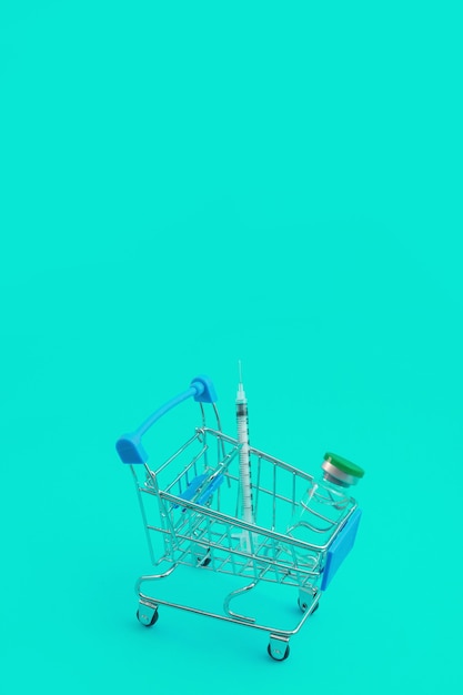 Supermarket trolley with syringes and ampoule isolated