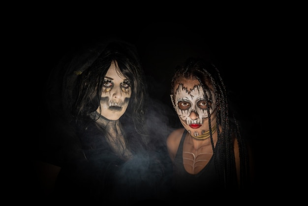 Supernatural entities, portrait of two supernatural entities, artistic makeup, black background, Low Key portrait, selective focus.