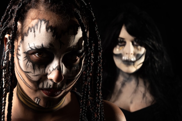 Supernatural entities, portrait of two supernatural entities, artistic makeup, black background, Low Key portrait, selective focus.