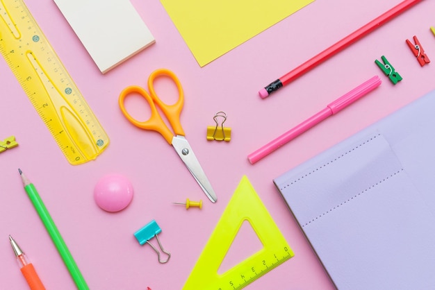 Supplies creative tools for school creative work on pink background