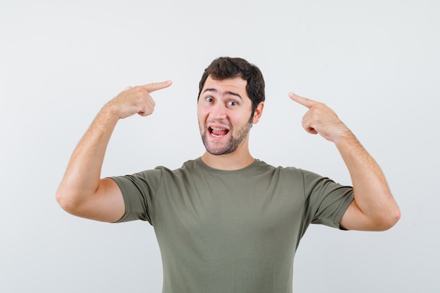 The suprising man is showing his head with forefingers on white background