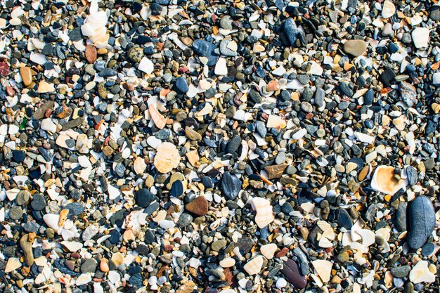 Surface of many small sea stones.