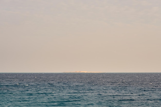 The surface of the water of the Red Sea with a horizon in the background