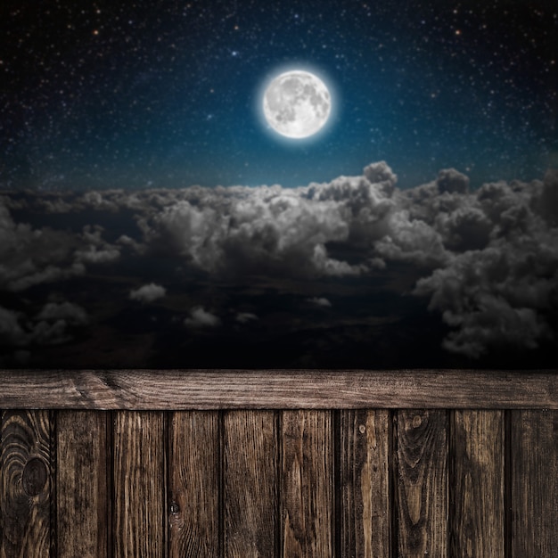 surfaces night sky with stars and moon and clouds. wood. Elements of this image furnished by NASA