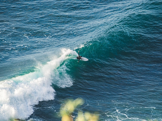 Surfer catching a wave on the north coast of Tenerife