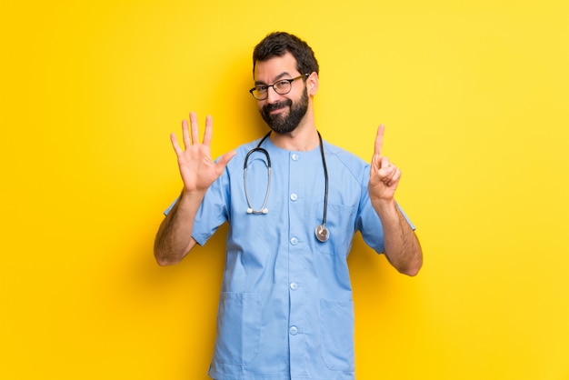 Surgeon doctor man counting six with fingers