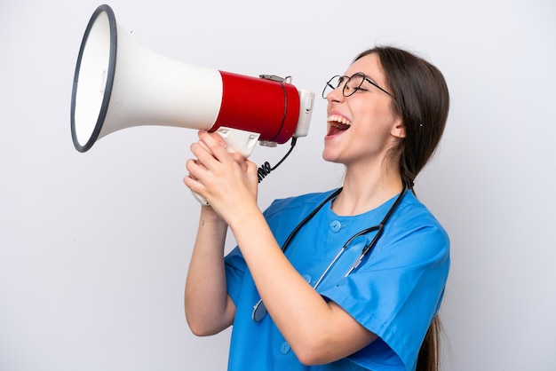 Surgeon doctor woman holding tools isolated on white background shouting through a megaphone