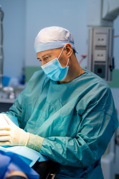 Surgeon in operation room Working with surgical instruments Modern equipment in operating room