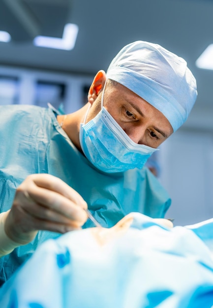 Surgeon performing complex surgery in the intensive care unit