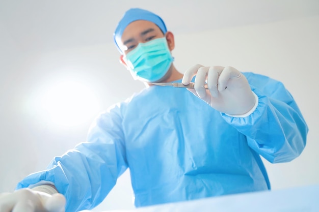 surgeon with surgical mask in Hospital Operating Theater.