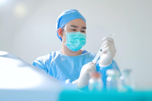 surgeon with surgical mask in Hospital Operating Theater.