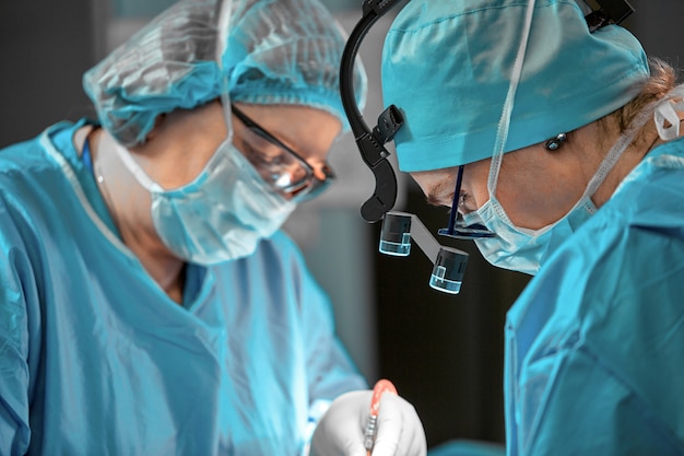 Surgeons team in the operating room, portraits close-up. modern operating, plastic surgery. Beauty industry