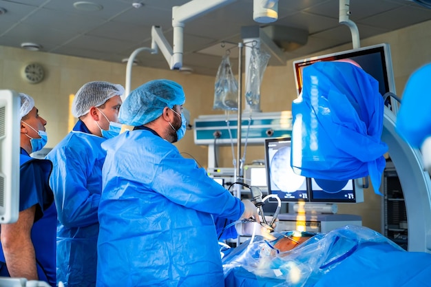 Surgeons working in operating room Hospital background Male doctors at work Background of an operation room