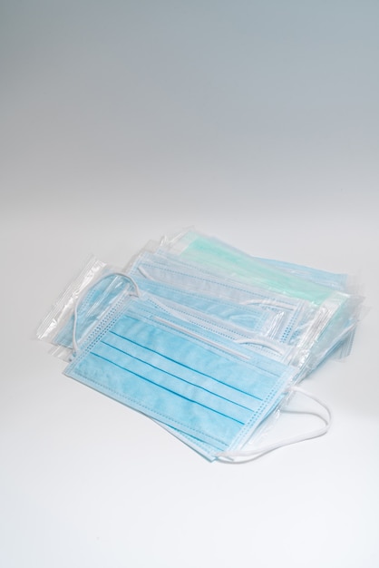 Surgical mask with rubber ear straps. Typical 3-ply surgical mask to cover the mouth and nose.