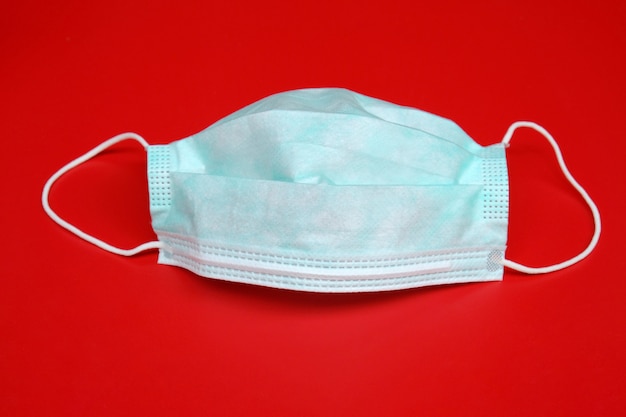 Surgical mask with rubber ear