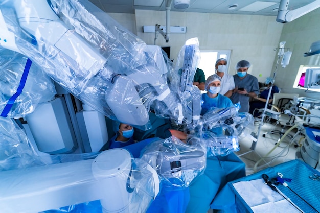 Surgical room in hospital with robotic technology equipment machine arm surgeon in futuristic operating room Minimal invasive surgical medical robot