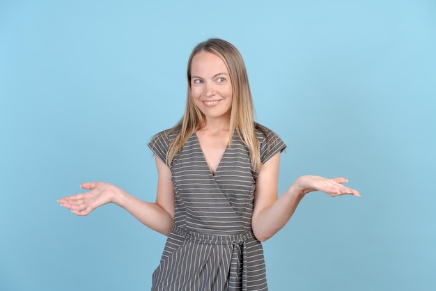 Surprise and shock Female half portrait isolated in Blue Studio Cute